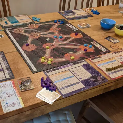 boardgame setup on a wooden table